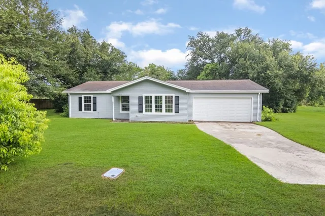 a house that has tree in front of it