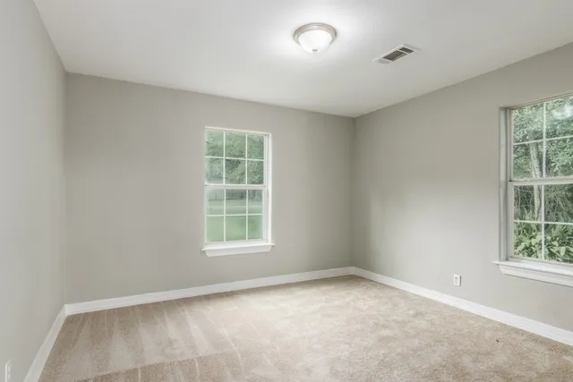an empty room with windows