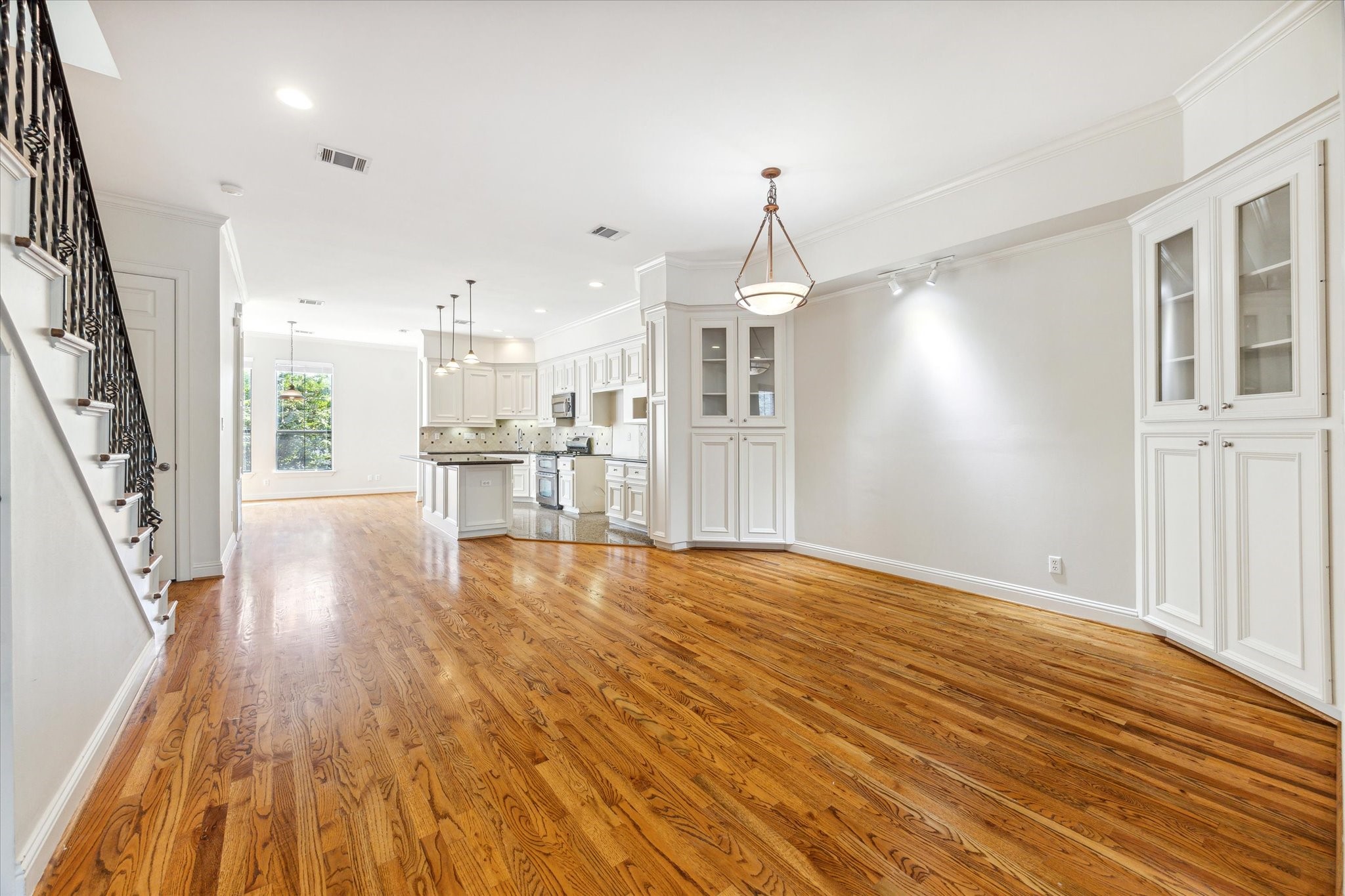 1231 West Pierce Street Houston, TX 77019 - Photo 17 of 33 The dining area is perfectly positioned between the staircase, living room and kitchen.