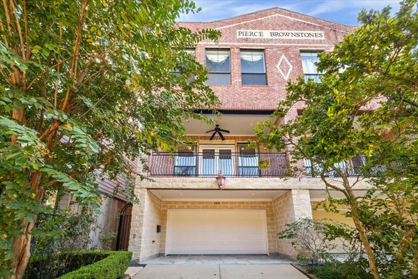 front view of a house with a garden