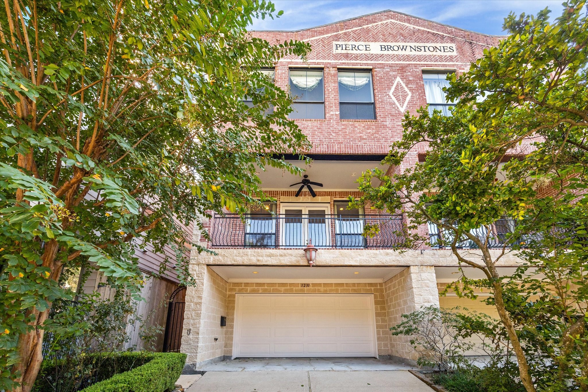 1231 West Pierce Street Houston, TX 77019 - Photo 2 of 33 Located in Montrose near Whole Foods and the River Oaks Shopping Center, this home offers convenient off-street parking with a wide driveway and a large garage equipped with a Tesla "Super" charging station.