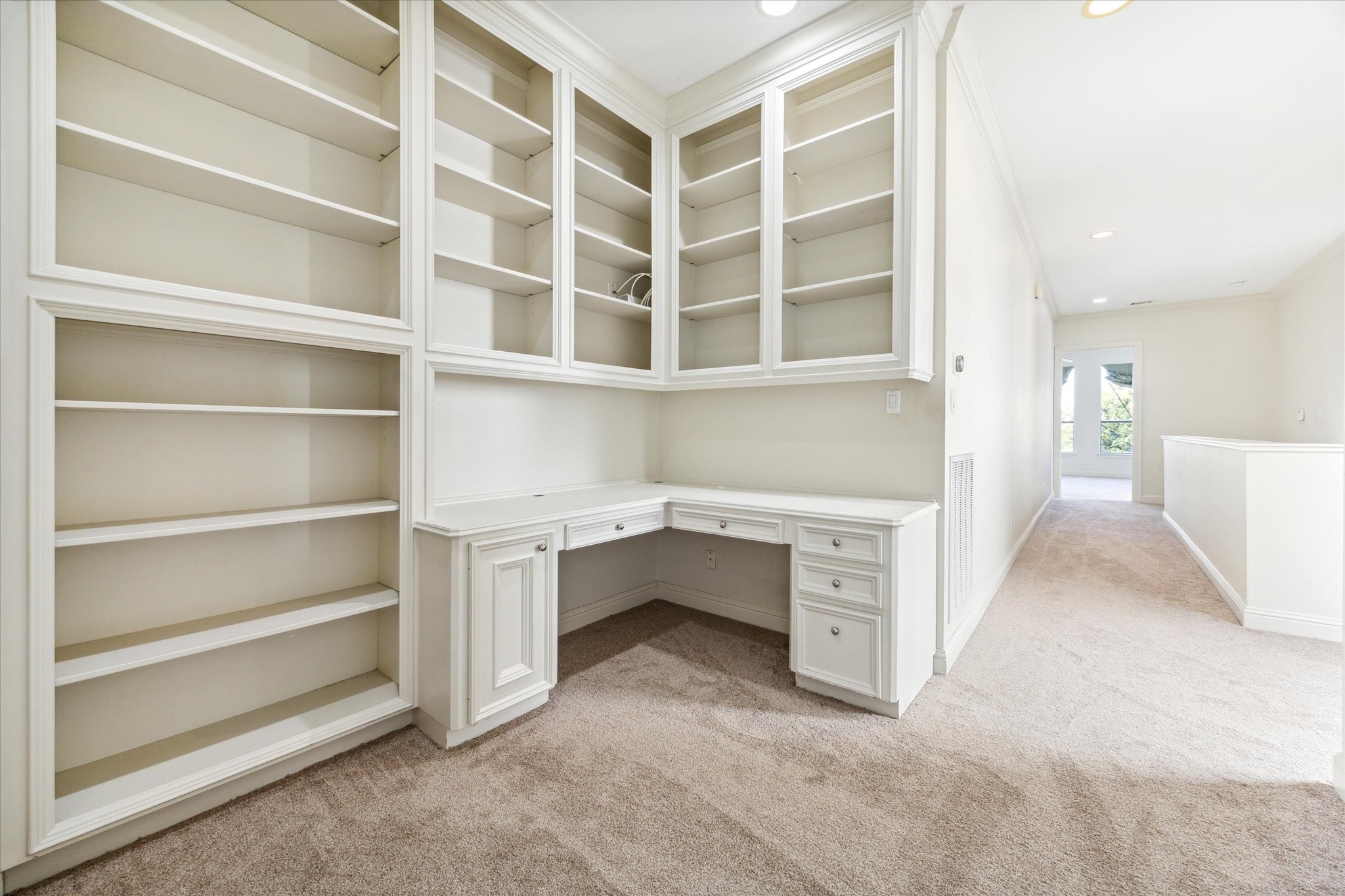 1231 West Pierce Street Houston, TX 77019 - Photo 30 of 33 On the top-floor landing, this convenient desk nook is perfect for work or study with a generous work service and abundant shelving.