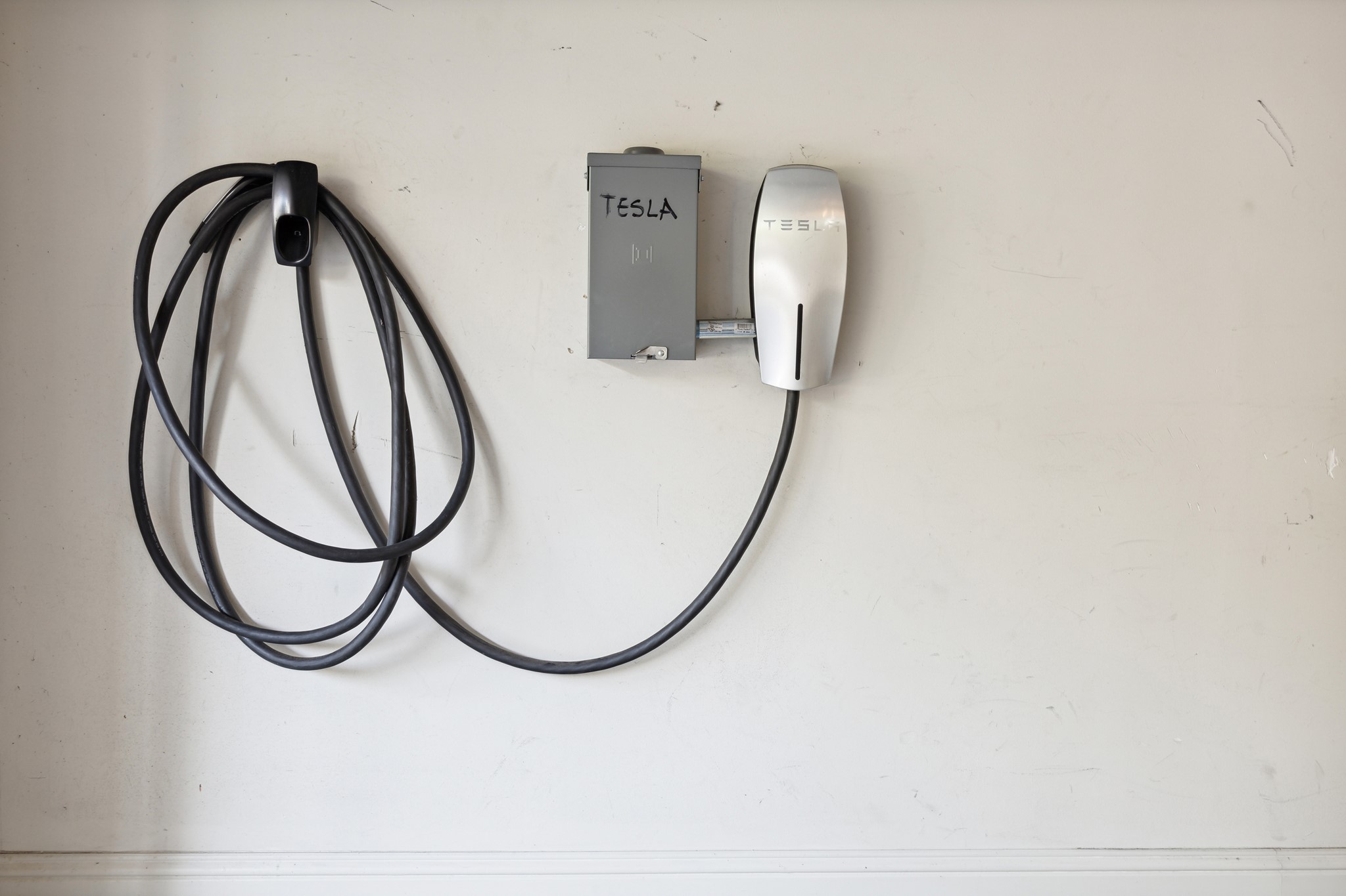 1231 West Pierce Street Houston, TX 77019 - Photo 33 of 33 This garage features a Tesla Supercharger, offering convenient and efficient vehicle charging .