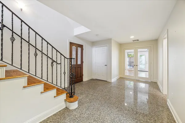 a view of an entryway with wooden floor