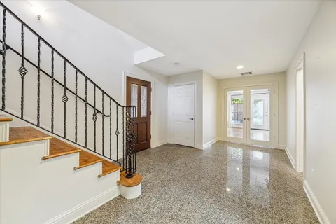 a view of an entryway with wooden floor