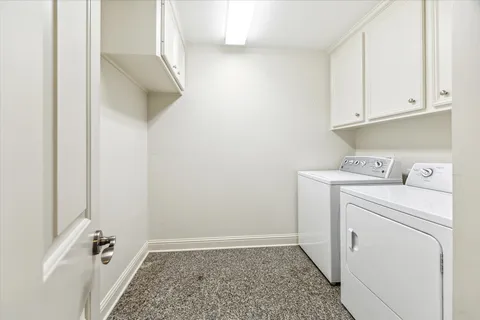 a view of storage and utility room with washer and dryer