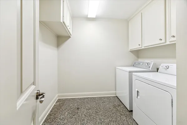 a view of storage and utility room with washer and dryer