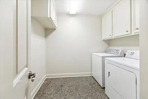 a view of storage and utility room with washer and dryer