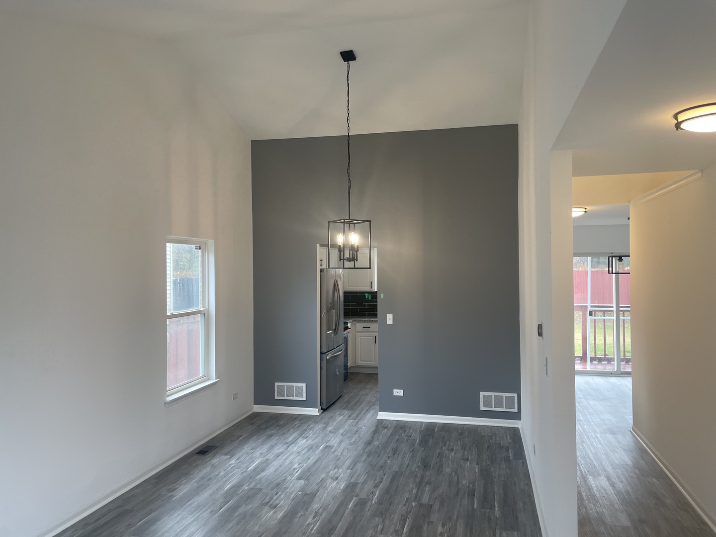 Undisclosed Address Round Lake, IL 60073 - Photo 3 of 15 a view of a room with wooden floor and window
