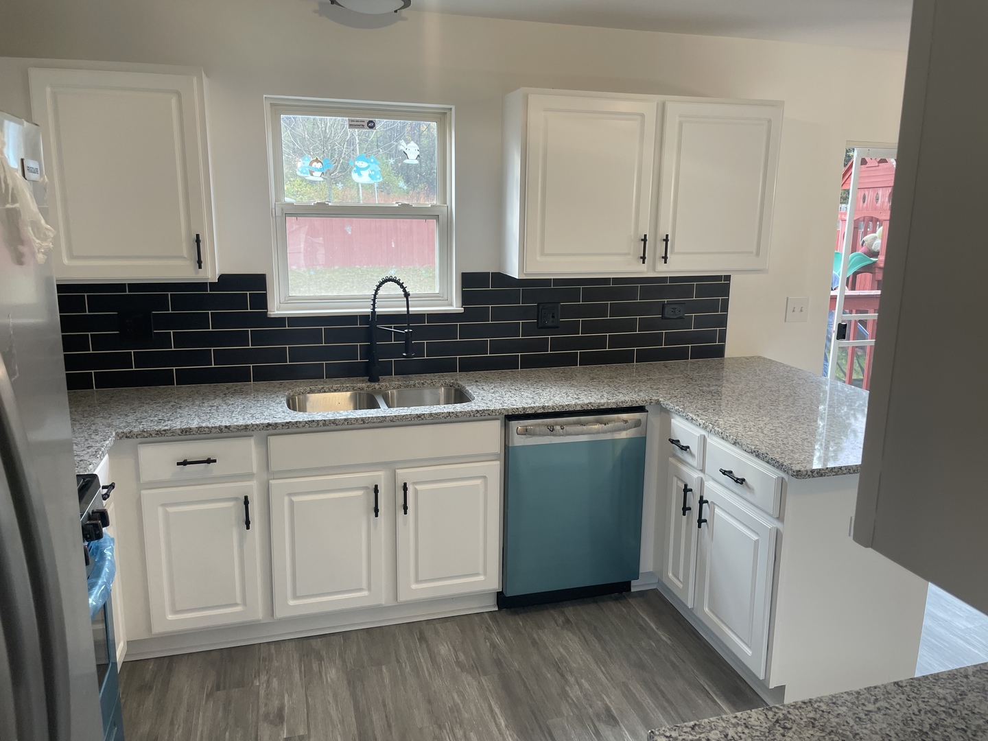 Undisclosed Address Round Lake, IL 60073 - Photo 6 of 15 a kitchen with granite countertop a sink and cabinets