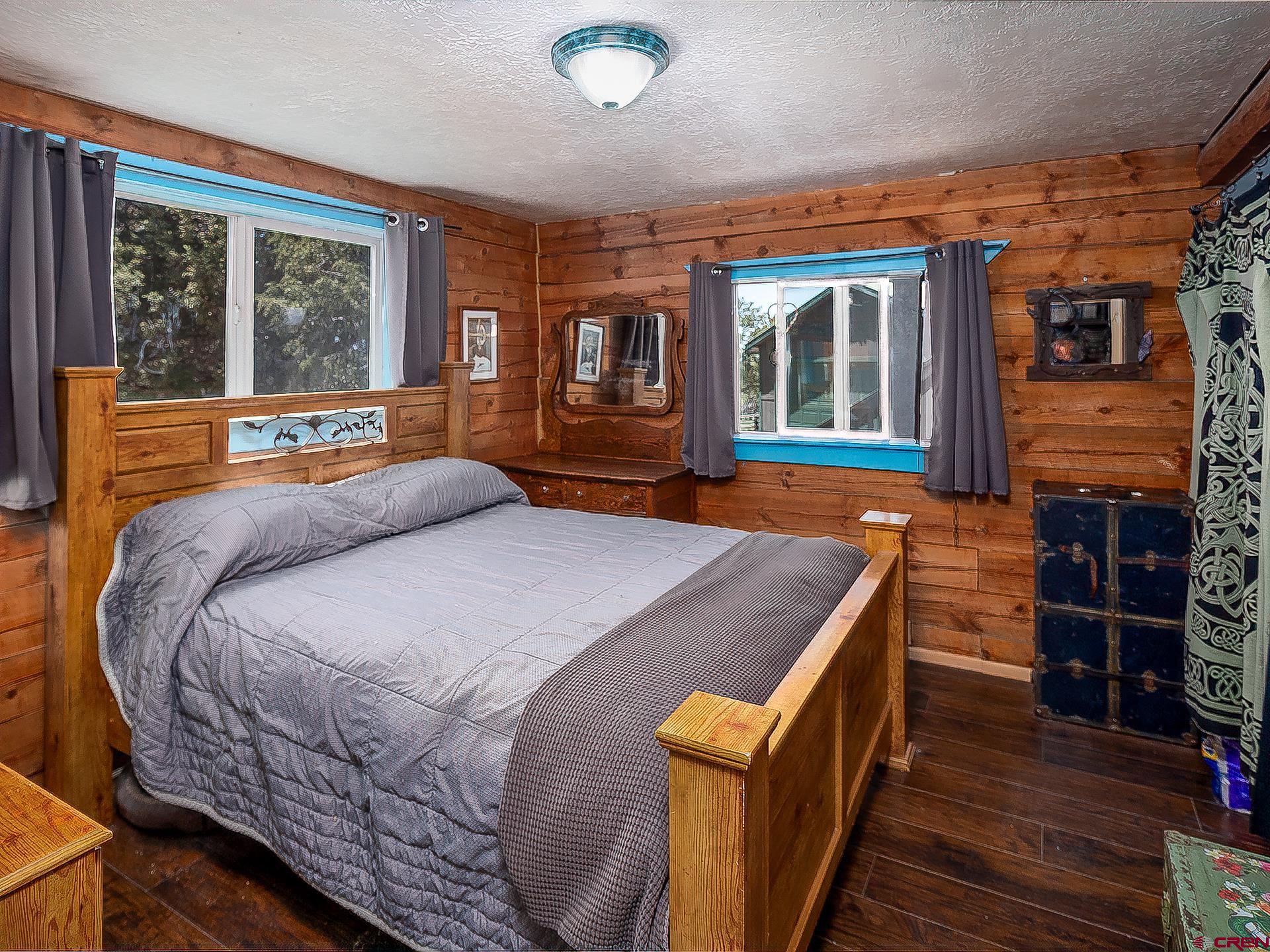 36859 Rd P.2 Mancos, CO 81328 - Photo 15 of 28 a bed sitting in a bedroom next to a window