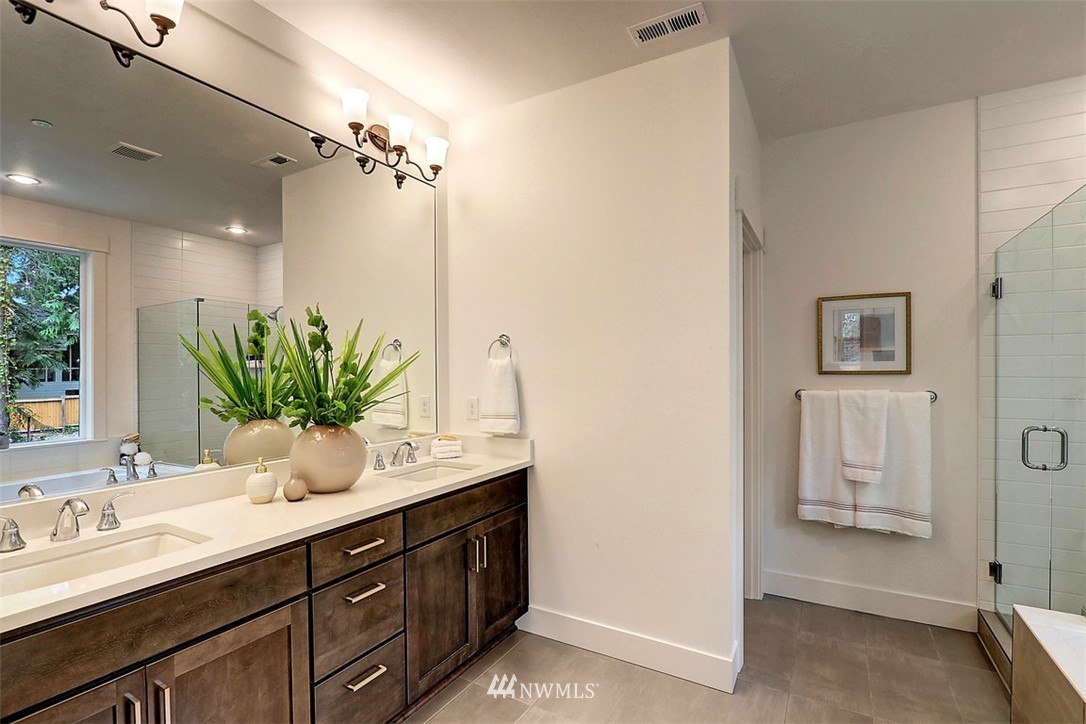 5 232nd Place Southeast Bothell, WA 98021 - Photo 14 of 21 a bathroom with a double vanity sink a mirror and a shower
