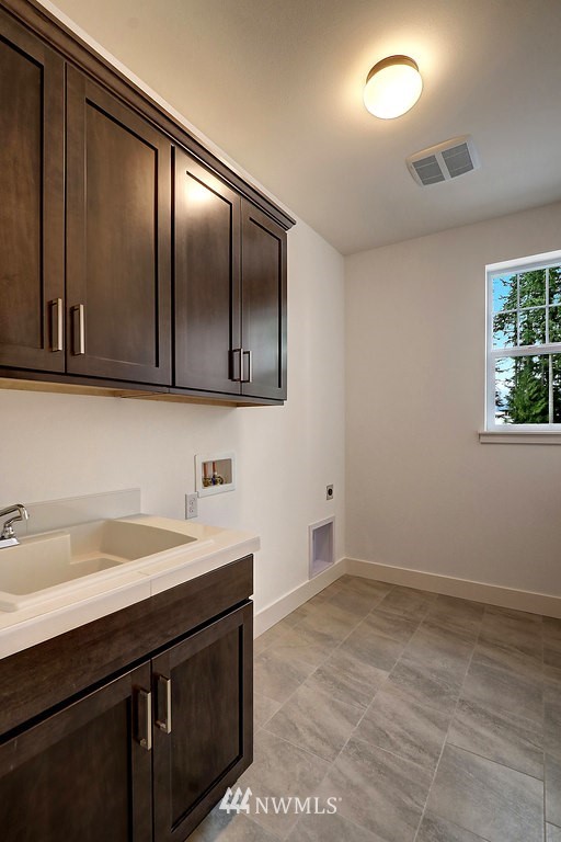 5 232nd Place Southeast Bothell, WA 98021 - Photo 17 of 21 a kitchen with a sink and cabinets