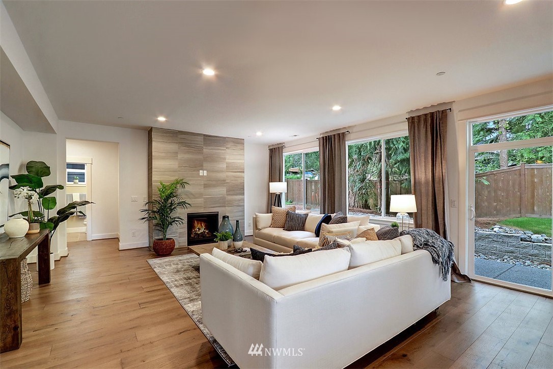 5 232nd Place Southeast Bothell, WA 98021 - Photo 8 of 21 a living room with fireplace furniture and a wooden floor