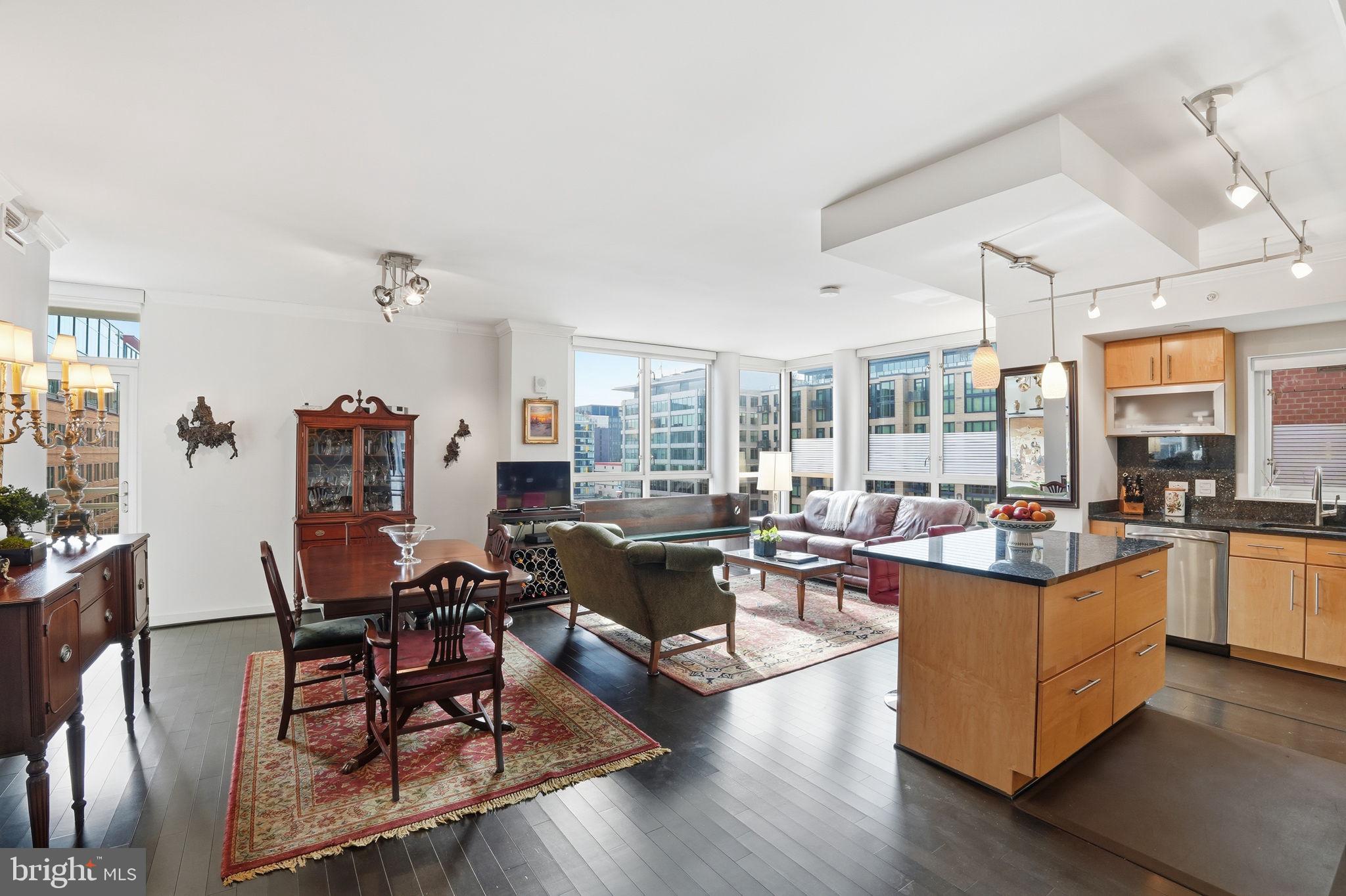 1025 First Street Southeast, Unit 906 Washington, DC 20003 - Photo 1 of 30 a living room with furniture and a large window