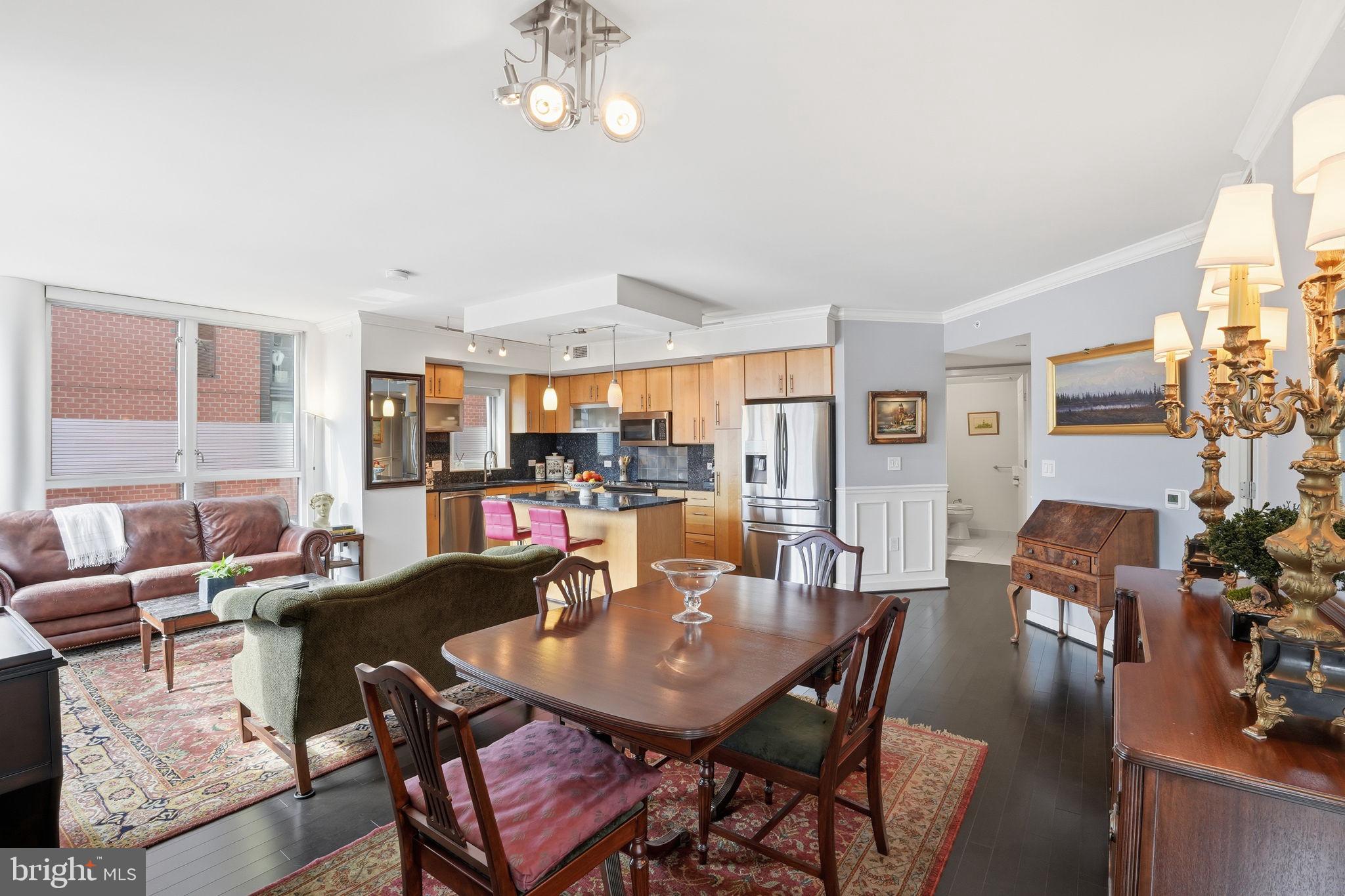 1025 First Street Southeast, Unit 906 Washington, DC 20003 - Photo 30 of 30 a view of a dining room with furniture window and wooden floor