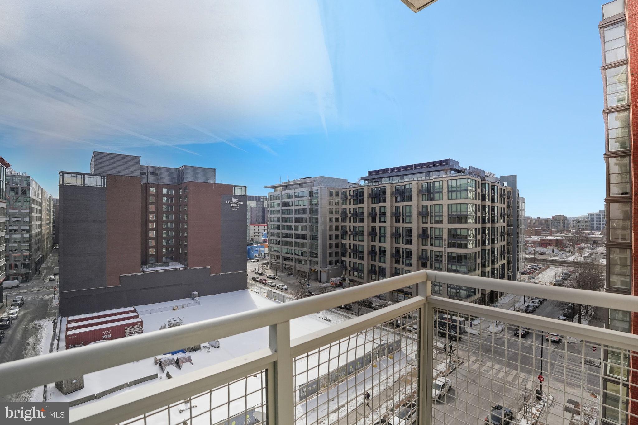 1025 First Street Southeast, Unit 906 Washington, DC 20003 - Photo 9 of 30 a view of balcony with a potted plant and wooden fence