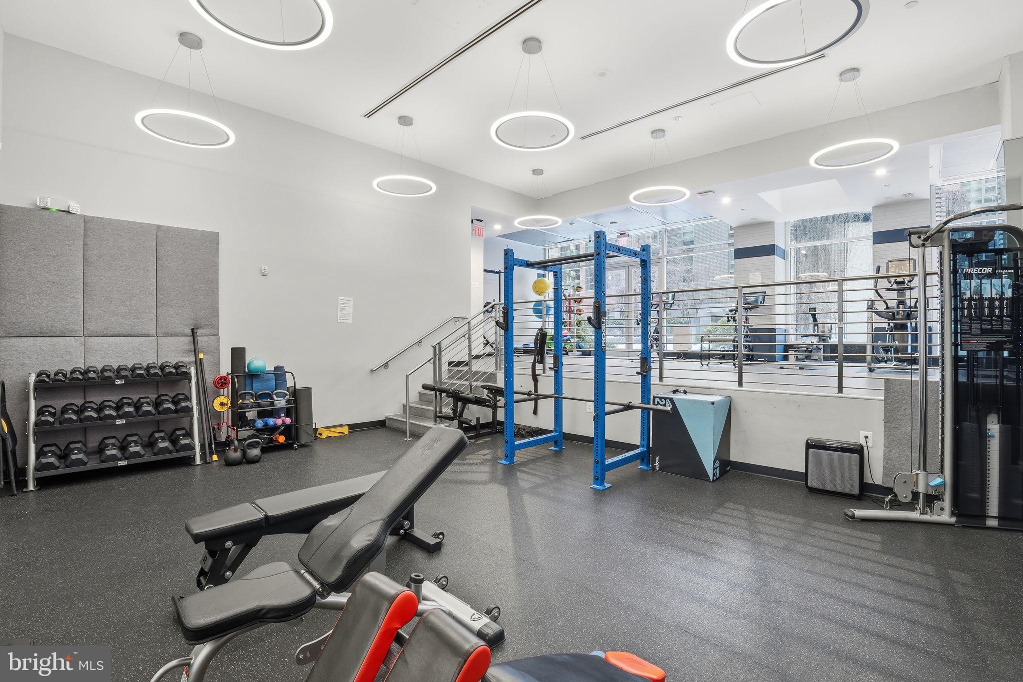 1025 First Street Southeast, Unit 906 Washington, DC 20003 - Photo 23 of 30 a room with lots of wooden furniture and a wooden floor