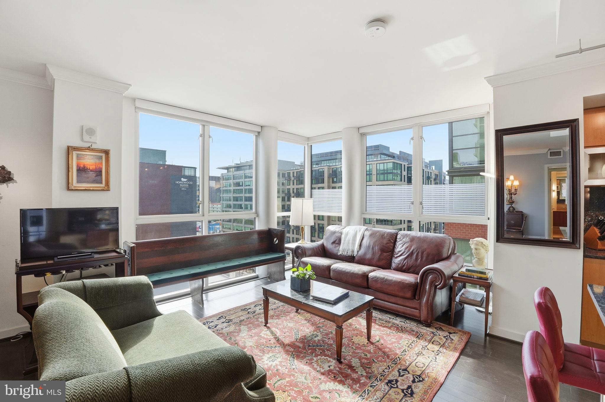 1025 First Street Southeast, Unit 906 Washington, DC 20003 - Photo 5 of 30 a living room with furniture and a large window