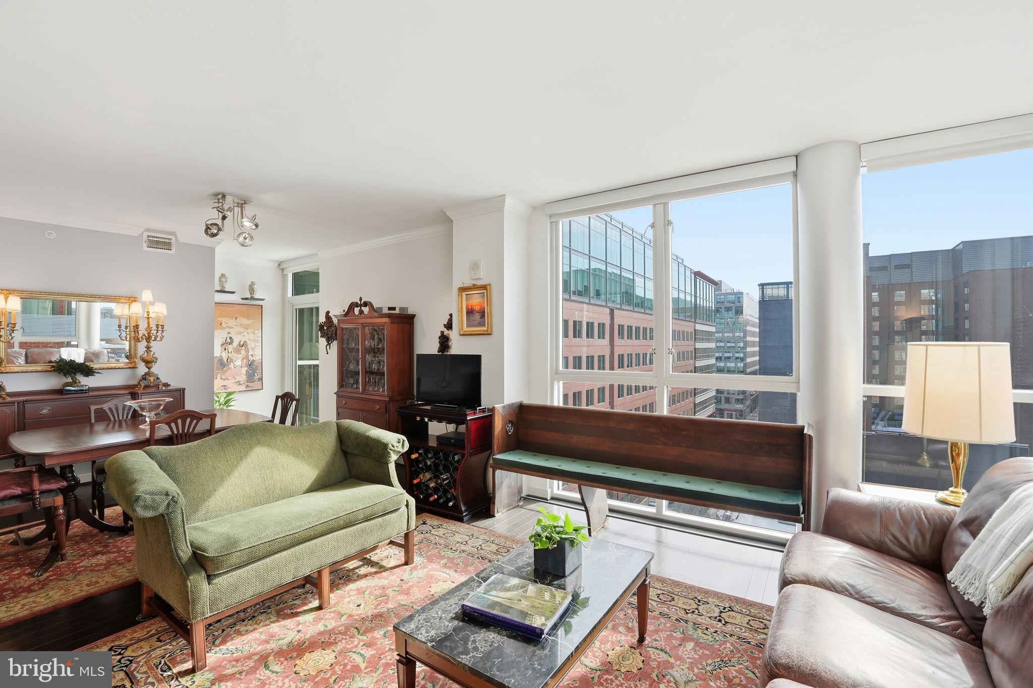 1025 First Street Southeast, Unit 906 Washington, DC 20003 - Photo 6 of 30 a living room with furniture and a large window