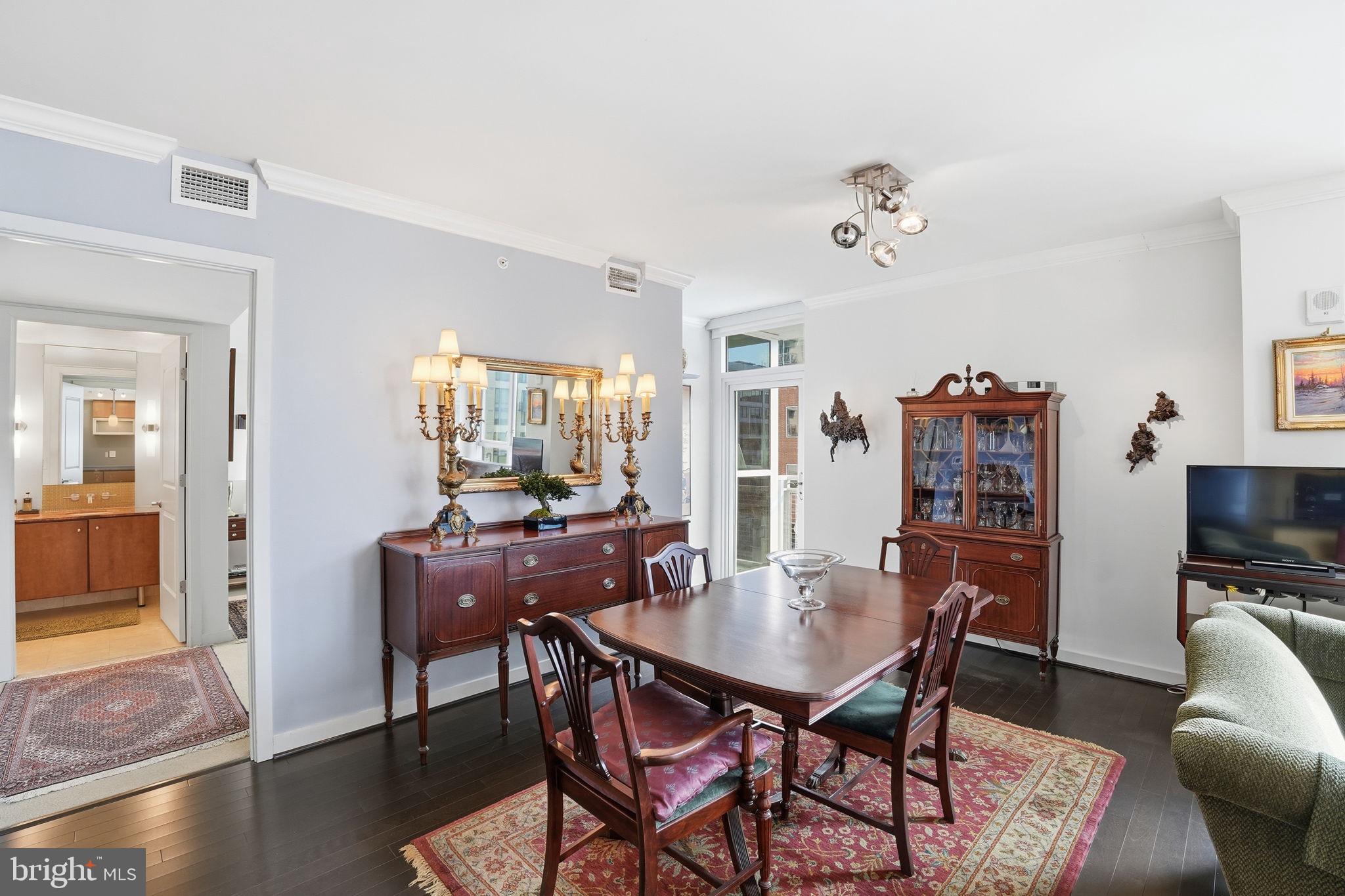 1025 First Street Southeast, Unit 906 Washington, DC 20003 - Photo 8 of 30 a view of a dining room with furniture