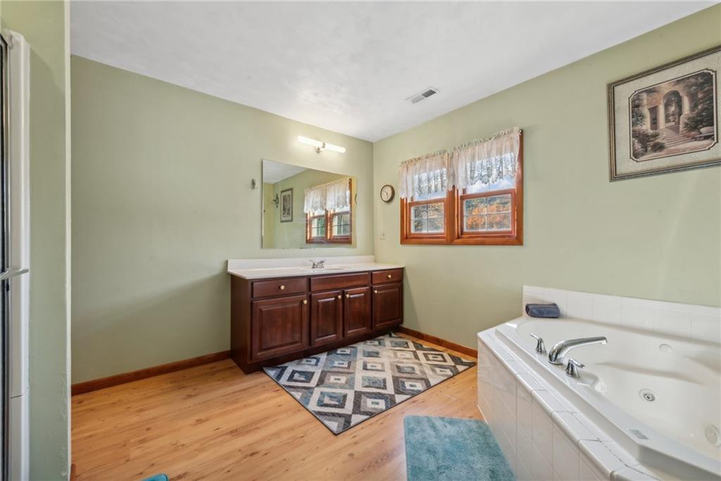 822 Old State Road Apollo, PA 15613 - Photo 17 of 22 a spacious bathroom with a tub sink and mirror