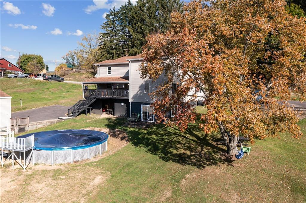 822 Old State Road Apollo, PA 15613 - Photo 20 of 22 a front view of a house with swimming pool and outdoor seating