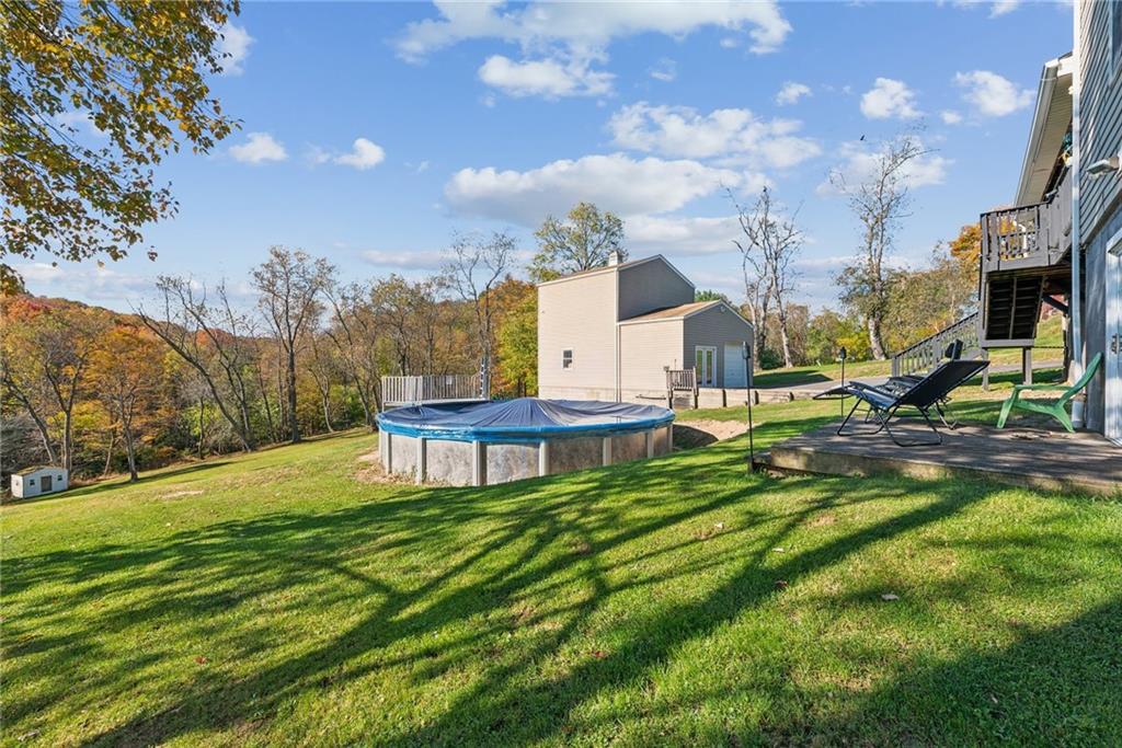 822 Old State Road Apollo, PA 15613 - Photo 4 of 22 a view of a garden with a bench