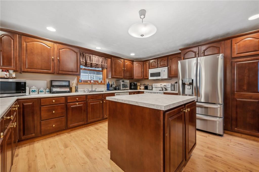 822 Old State Road Apollo, PA 15613 - Photo 7 of 22 a kitchen with a refrigerator sink and cabinets