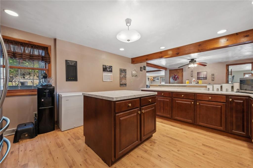 822 Old State Road Apollo, PA 15613 - Photo 8 of 22 a kitchen with stainless steel appliances granite countertop a refrigerator a sink dishwasher a stove with wooden cabinets and floor