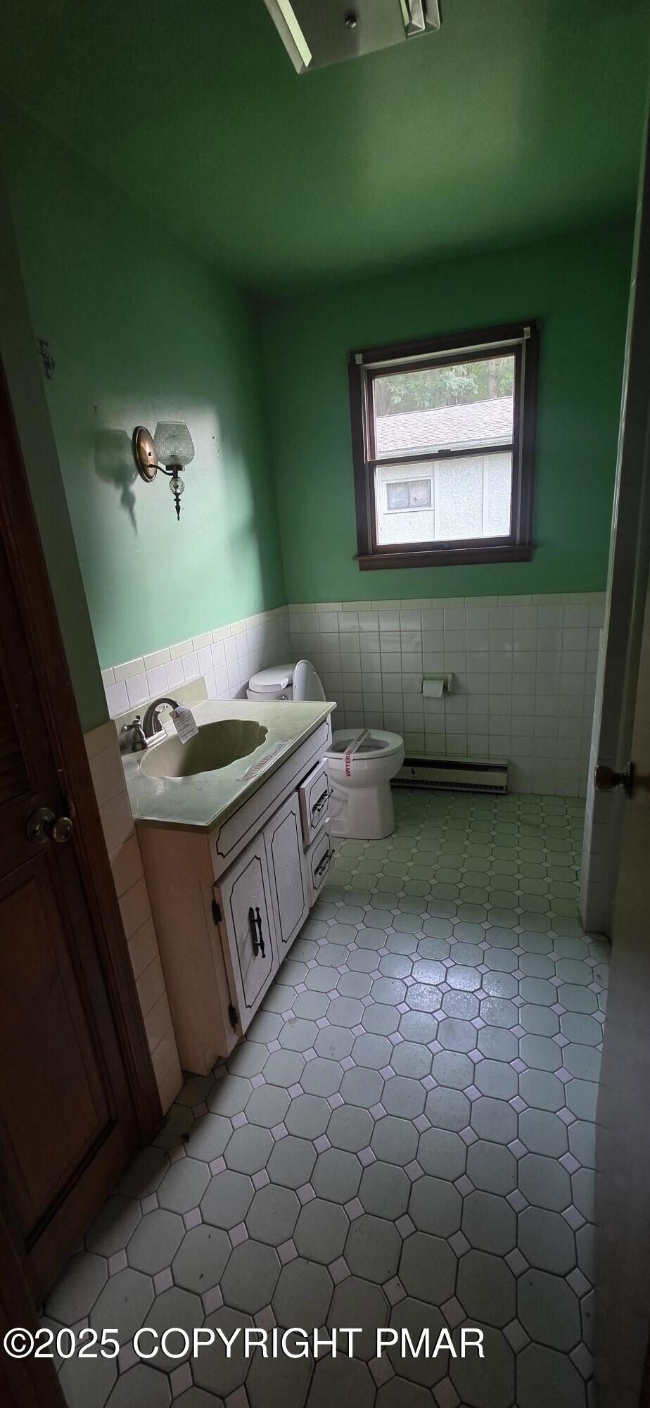 1829 South Webster Avenue Scranton, PA 18505 - Photo 20 of 40 a kitchen with a stove and a microwave