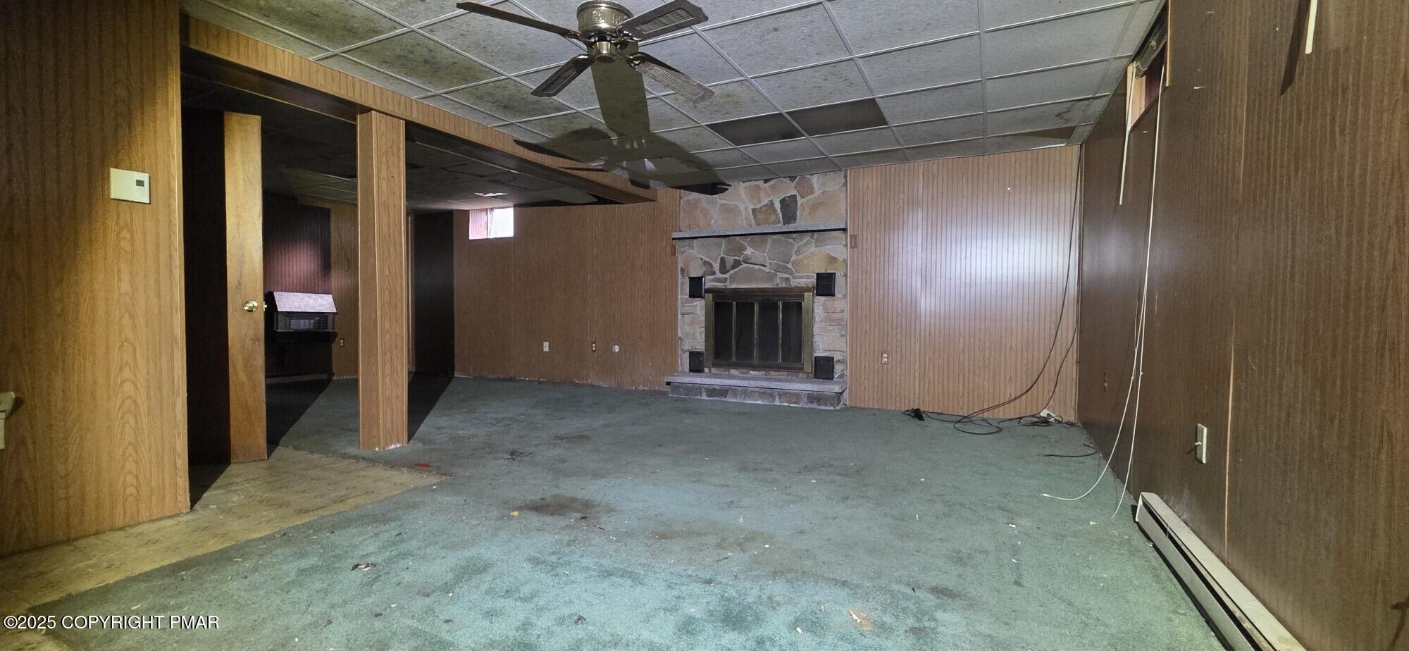 1829 South Webster Avenue Scranton, PA 18505 - Photo 29 of 40 an empty room with fireplace and fan