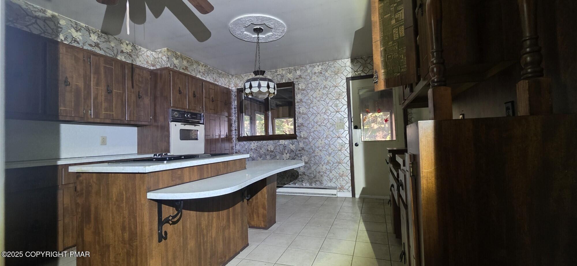 1829 South Webster Avenue Scranton, PA 18505 - Photo 8 of 40 a kitchen with stainless steel appliances granite countertop a refrigerator a sink dishwasher a stove and a dining table with wooden floor