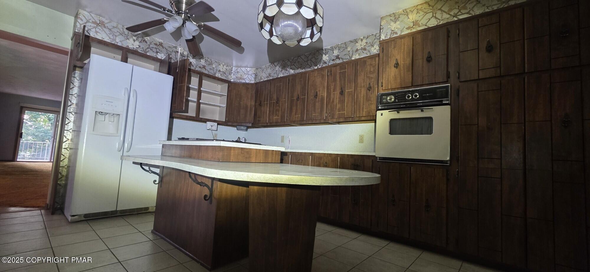 1829 South Webster Avenue Scranton, PA 18505 - Photo 9 of 40 a kitchen with stainless steel appliances granite countertop a sink stove and refrigerator