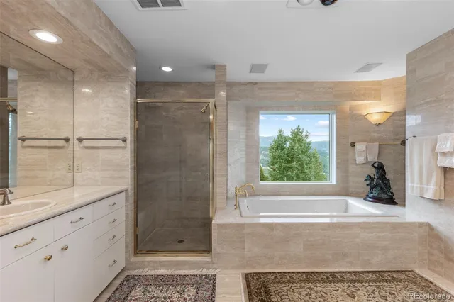 a bathroom with a shower and a bathtub