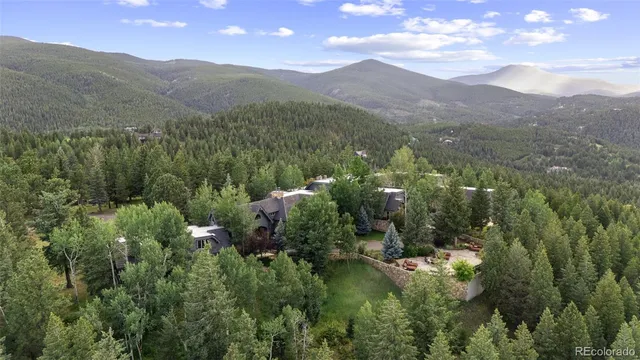 a view of a town with mountains in the background