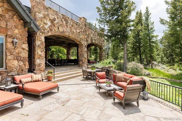 a outdoor space with patio furniture and a fireplace