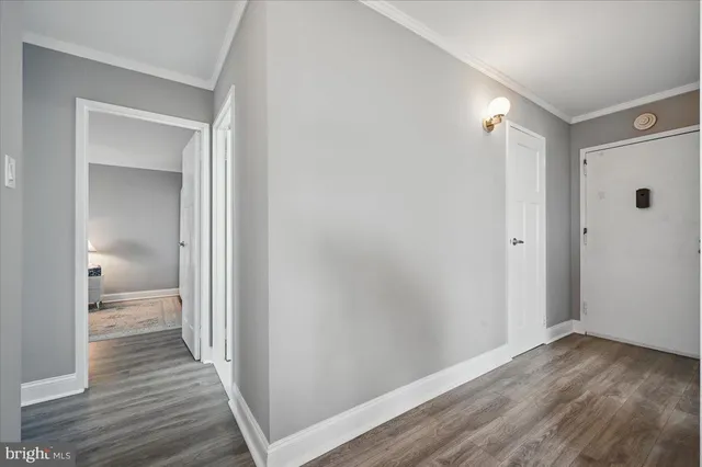 a view of a room with wooden floor