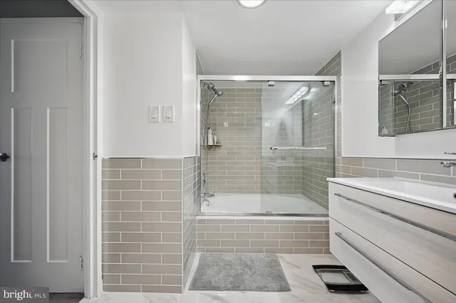 a bathroom with a shower and a bathtub