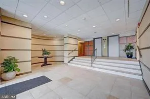 a view of a livingroom with furniture and a potted plant