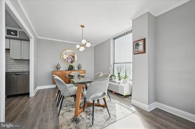 a view of a dining room with furniture and wooden floor