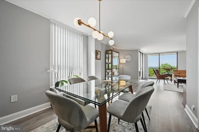 a view of a dining room with furniture and window