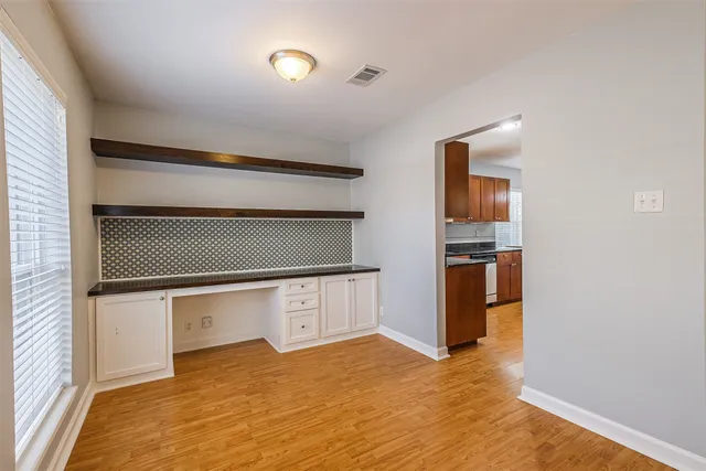 a view of kitchen and wooden floor