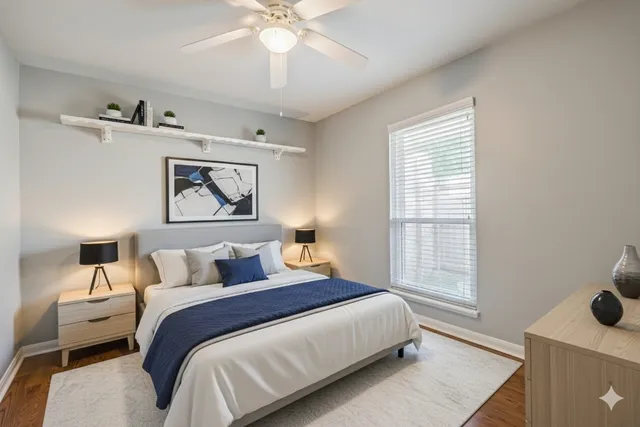 a bedroom with a large bed and a window