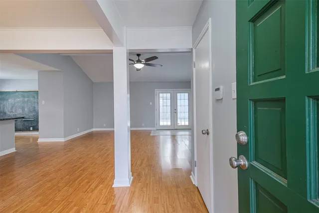 wooden floor in a hall with a window