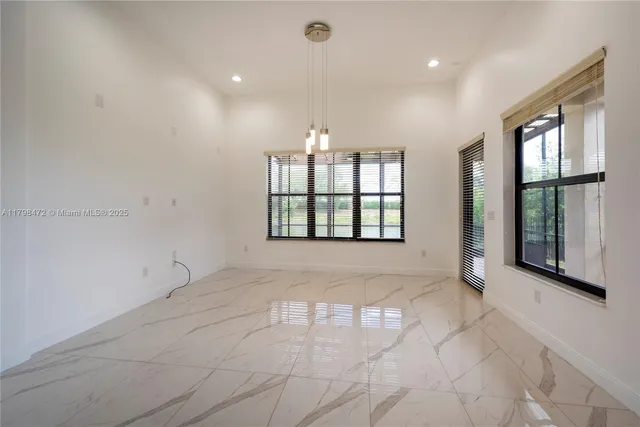a bathroom with a bathtub sink and mirror