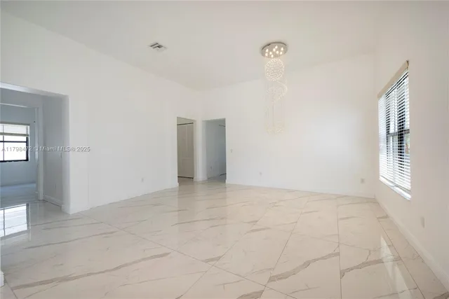 a large bathroom with a large window and double vanity