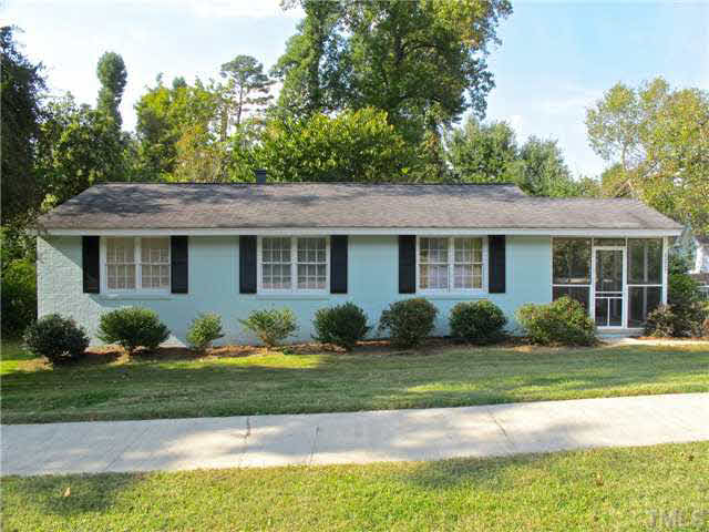 1217 North King Charles Road Raleigh, NC 27610 - Photo 1 of 17 a front view of a house with garden and porch