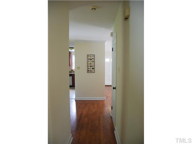 1217 North King Charles Road Raleigh, NC 27610 - Photo 11 of 17 a view of a room with door open and a hallway