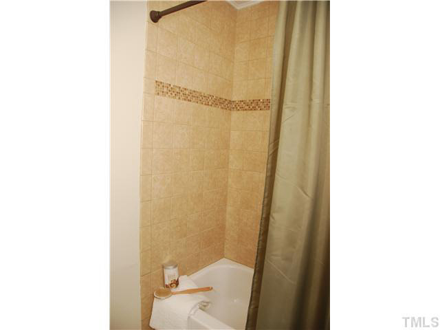 1217 North King Charles Road Raleigh, NC 27610 - Photo 15 of 17 a bathroom with a shower and a toilet